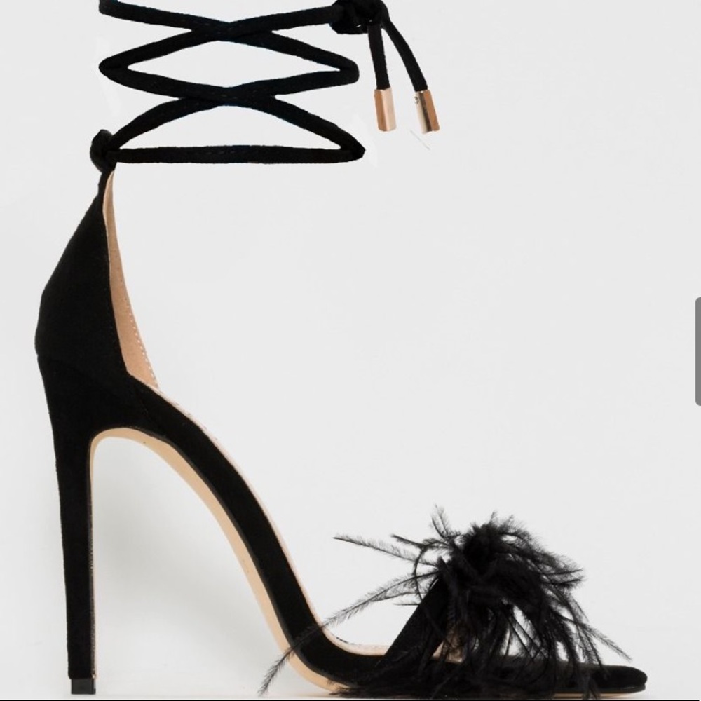 Black lace up heels with feather on toe